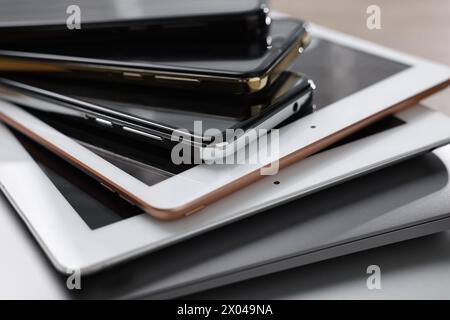 Many different modern gadgets on table, closeup Stock Photo