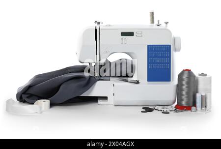 Sewing machine with fabric and craft accessories isolated on white Stock Photo