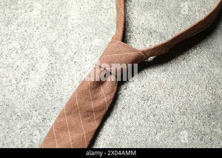 One striped necktie on grey textured table, top view Stock Photo - Alamy