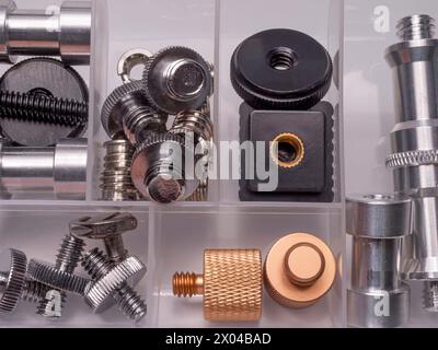 A box with accessories for mounting various equipment for photo and video shooting. Flat layer. Stock Photo