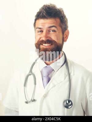 Healthcare, treatment and medical staff concept. Portrait of smiling man doctor in medical gown with stethoscope on neck. Handsome friendly bearded Stock Photo