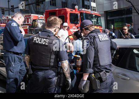 Seattle, USA. 17 Mar 2024. Police & Fire responding to a woman pinned between two vehicles. Stock Photo