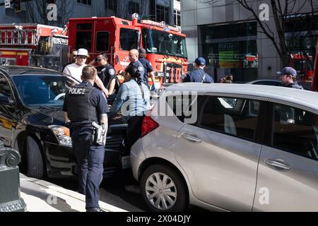 Seattle, USA. 17 Mar 2024. Police & Fire responding to a woman pinned between two vehicles. Stock Photo