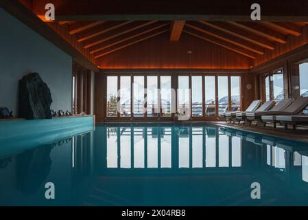 Luxurious Indoor Swimming Pool with Mountain Views Stock Photo - Alamy