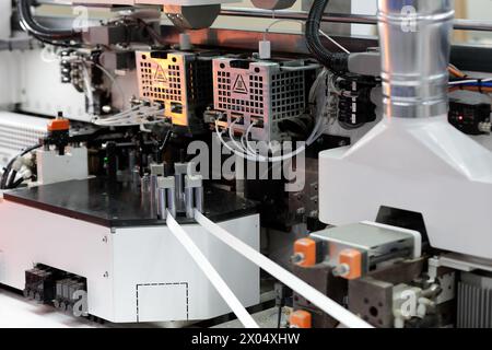 Part of double sided automatic edge banding machine. Selective focus. Stock Photo