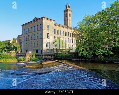 UK, West Yorkshire, City of Bradford, Shipley, Saltaire, River Aire Weir and New Mill. Stock Photo