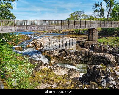 UK, North Yorkshire, Grassington, Tin Bridge over Linton Falls and River Wharfe. Stock Photo