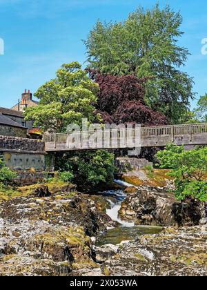 UK, North Yorkshire, Grassington, Tin Bridge over Linton Falls and River Wharfe. Stock Photo