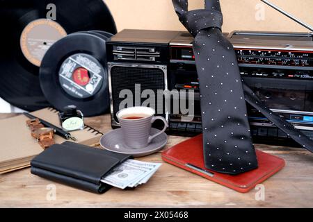 International Father's Day, empty blank for text, black tie, money American dollars in purse, wrist watch, e-book in leather case, top view on items, Stock Photo