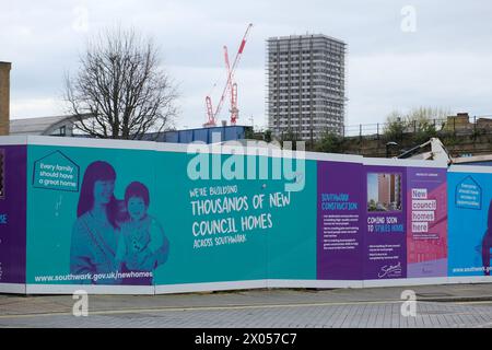 London, UK. Southwark Council promises new council homes on building site hoardings in the London borough. Stock Photo