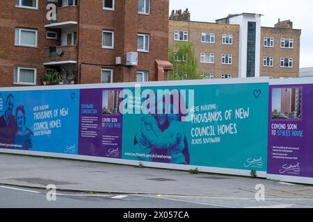 London, UK. Southwark Council promises new council homes on building site hoardings in the London borough. Stock Photo