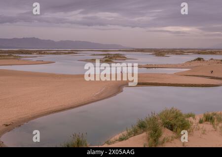 The lake in the middle of the desert. A unique landscape of Wuhai city in Inner Mongolia, China. Dramatic sky with copy space for text Stock Photo