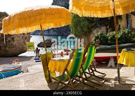 Sun umbrellas and deck chairs beach scene at Marina Piccola, Capri, Campania, Italy, Europe Stock Photo