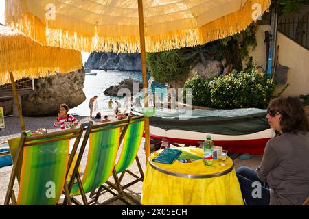 Sun umbrellas and deck chairs beach scene at Marina Piccola, Capri, Campania, Italy, Europe Stock Photo