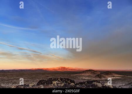 last light on distant Whipple Mountains High Point Mountain with expansive sky in the Mojave Desert of eastern California Stock Photo