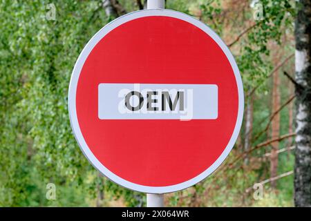 OEM original equipment manufacturer concept. Text traffic is prohibited on the sign against the background of the forest Stock Photo