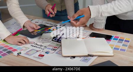 Brainstorm team of creative web graphic designer planning. Creative designers present ux ui to team. Designers team working meeting in office Stock Photo