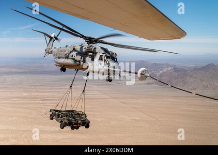 A U.S. Marine Corps CH-53E Super Stallion aircraft, assigned to Marine Aviation Weapons and Tactics Squadron One, participates in an air-to-air refuel Stock Photo