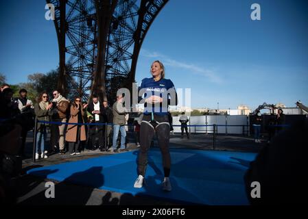 Paris, France. 10th Apr, 2024. Anouk Garnier breaks the world record for climbing the Eiffel Tower, using a rope to climb to the second floor, in Paris, France on April 10, 2024. The two-time world obstacle course champion trained for a whole year to try and beat the world rope-climbing record, reaching the 2nd floor of the Eiffel Tower from a height of 110 metres. Photo by Florian Poitout/ABACAPRESS.COM Credit: Abaca Press/Alamy Live News Stock Photo