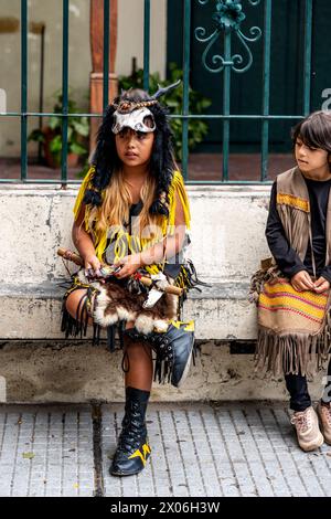 A Child In Costume Waits To Perform At The Salta Carnival, Salta Province, Argentina Stock Photo