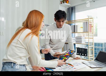 team of UI UX web designer are working together to develop mobile responsive websites with UI UX front end designer previews Stock Photo