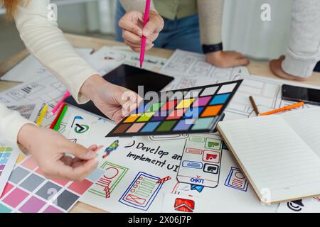team of UI UX web designer are working together to develop mobile responsive websites with UI UX front end designer previews Stock Photo