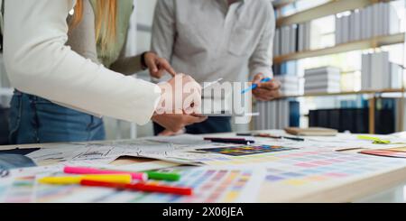 team of UI UX web designer are working together to develop mobile responsive websites with UI UX front end designer previews Stock Photo