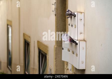 Outside Mailboxes with magazines in Lisbon, Portugal. February 1, 2024. Stock Photo