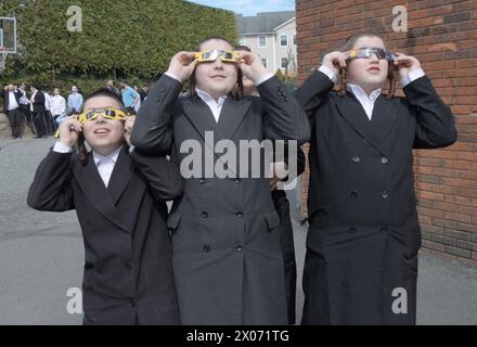 3 orthodox Jewish yeshiva students watch the 2024 Solar eclipse in ...