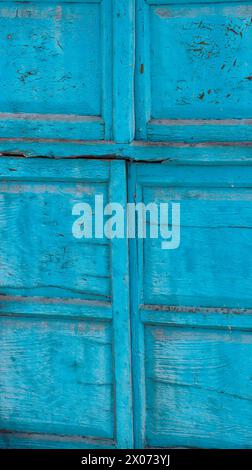 close-up of an antique wooden door in turquoise blue. wood texture. Stock Photo