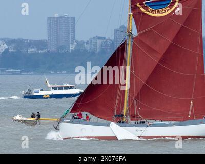 Sheerness, Kent, UK. 10th Apr, 2024. UK Weather: sunny spells for the crew of Thames sailing barge Blue Mermaid seen passing Sheerness in Kent this afternoon. Blue Mermaid is owned by Sea-Change Sailing Trust (providing opportunities for young people and vulnerable adults) who were delivering a cargo of timber to Lower Halstow. Credit: James Bell/Alamy Live News Stock Photo