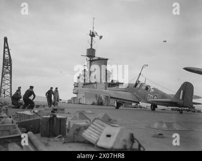 THE ROYAL NAVY DURING THE SECOND WORLD WAR - A Fairey Fulmar being flagged off from the flight deck of HMS VICTORIOUS at Scapa Flow. The carrier's island can be seen in the background  Royal Navy, VICTORIOUS (HMS), aircraft carrier Stock Photo