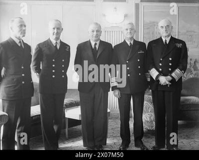 ADMIRAL CUNNINGHAM ENTERTAINED TO LUNCHEON BY COMMANDER US NAVY IN EUROPE, ADMIRAL STARK, USN. 29 MAY 1942, DORCHESTER HOTEL, LONDON. ADMIRAL SIR ANDREW CUNNINGHAM, HEADING THE ADMIRALTY DELEGATION TO WASHINGTON WAS ENTERTAINED AT THE DORCHESTER HOTEL AT A RETURN LUNCHEON GIVEN BY ADMIRAL STARK. THE FIRST LORD OF THE ADMIRALTY AND THE FIRST SEA LORD WERE ALSO PRESENT. - Left to right: Rear Admiral Alan G Kirk, Chief of Staff to Admiral Stark and Naval Attache; Admiral Cunningham; Mr A V Alexander; Admiral Stark, and Admiral of the Fleet Sir Dudley Pound, at a luncheon Stock Photo