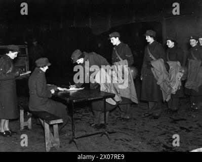 Members of the Auxiliary Territorial Service line up with troops for ...