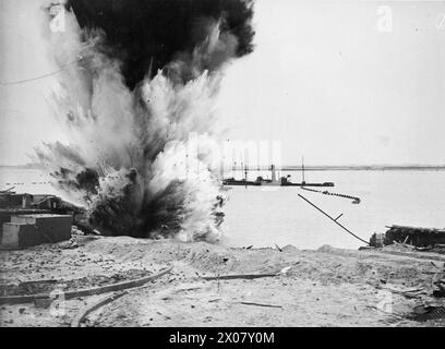 HOW THE ROYAL NAVY CLEARED THE SCHELDT TO ANTWERP. 20 TO 30 NOVEMBER 1944, ON BOARD BYMS 2189. THE ROYAL NAVY SWEEPING THE SCHELDT CHANNEL CLEAR OF MINES TO ALLOW ACCESS TO ANTWERP. - Close up near shore a mine explodes (at Zeebrugge, not Scheldt) Stock Photo