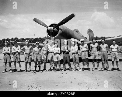 AT HMS RAJALYIA, ROYAL NAVAL AIR STATION, COLOMBO, CEYLON. FEBRUARY 1945, ACTIVITIES AND PERSONNEL OF THE STATION. - Birmingham men serving at the station, in front of a Chance-Vought Corsair, stripped to the waist for the sake of comfort whilst working in the heat. Left to right: AM (O) W Partridge, Oakham; AM (O) J Taylor, Smethwick; AM (O) C J Marshall, King's Heath; AF (E) C A Stanford, West Bromwich; AM (E) G F Owen, Low Hill, Birmingham; AM (L) W Ward, Birmingham; Petty Officer (E) Foley Park, Kiddiminster; AM (A) J Ward, West Bromwich; AM (A) R G Luckman' Bearwood, Birmingham; AM (E) G Stock Photo