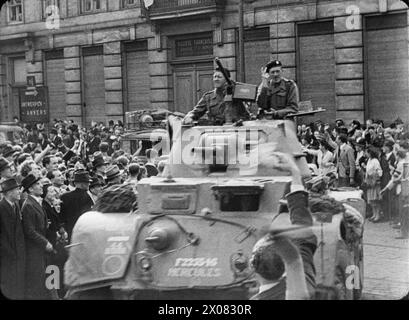 THE BRITISH ARMY IN NORTH-WEST EUROPE 1944-45 - Scenes of jubilation as British troops liberate Brussels, 4 September 1944. Lt Col H A Smith, CO of 2nd Household Cavalry Regiment, arrives in his Staghound armoured car  British Army Stock Photo