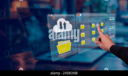 the entrepreneur interacts with a hologram that shows folders, files and business documents from a huge database hosted on secure servers in the cloud Stock Photo