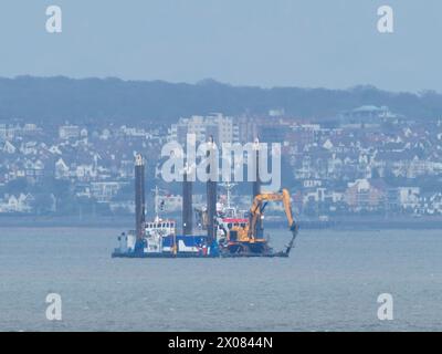 Sheerness, Kent, UK. 10th Apr, 2024. The NeuConnect Interconnector project aims to link Germany and the UK with a power cable, connecting two of Europe’s largest energy markets for the first time. Jack-up barge Abeko Server 2 was seen offshore of the Isle of Grain and Sheerness undertaking UXO (unexploded ordnance) investigation works today. Credit: James Bell/Alamy Live News Stock Photo