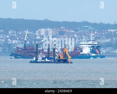 Sheerness, Kent, UK. 10th Apr, 2024. The NeuConnect Interconnector project aims to link Germany and the UK with a power cable, connecting two of Europe’s largest energy markets for the first time. Jack-up barge Abeko Server 2 was seen offshore of the Isle of Grain and Sheerness undertaking UXO (unexploded ordnance) investigation works today. Credit: James Bell/Alamy Live News Stock Photo