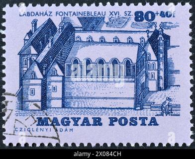 Cancelled postage stamp printed by Hungary, that shows Tennis court, Fountainbleau, circa 1965. Stock Photo