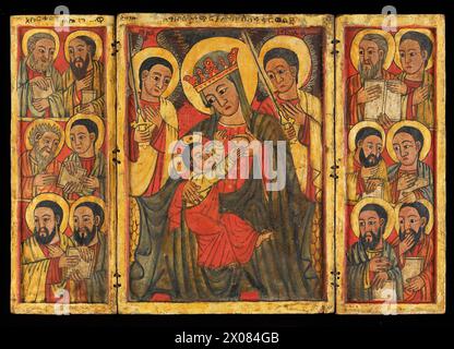 Icon - Ethiopian Orthodox -This Ethiopian Orthodox icon is influenced by the art of the European Renaissance and features the Virgin Mary nursing the infant Christ on the central panel. The figures of the twelve Apostles are depicted in the opposing side panels, dating the triptych to the middle or second half of the 15th century. Stock Photo