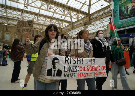 London, UK. 10th Apr, 2024. Youth Demand, a group formed by members of Just Stop Oil, protest to ask for an end to the genocide in Palestine. The march went through central London and in and out multiple underground stations with people chanting. Credit: Joao Daniel Pereira/Alamy Live News Stock Photo