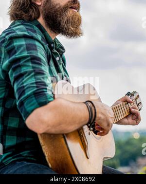 Music lifestyle man playing guitar nature concept. Hands of man musician playing guitar. Acoustic guitars playing. Music concept. Guitars acoustic Stock Photo