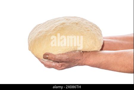 Female hands holding raw dough on white background. Hands holding a finished clean dough. Hands holding dough ready for baking, closeup. Old woman Stock Photo