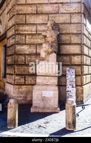 Pasquino statue. The statue is known as the first of the talking statues of Rome, because of the tradition of attaching anonymous criticisms to its base. The satirical literary form pasquinade takes its name from this tradition - Rome, Italy Stock Photo