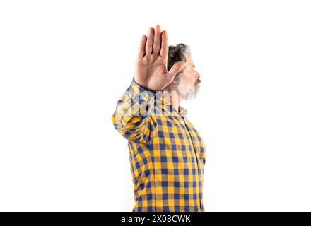 Middle age man wearing casual clothes makes a stop gesture with sad and afraid expression. shameful and negative concept. Stock Photo