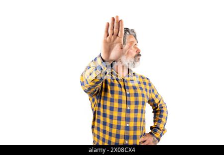 Middle age man wearing casual clothes makes a stop gesture with sad and afraid expression. shameful and negative concept. Stock Photo