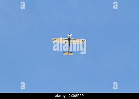 Single engine plane flying with a beautiful blue sky in Rio de Janeiro, Brazil. Stock Photo
