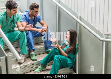 Medics having coffee and watching tablet Stock Photo